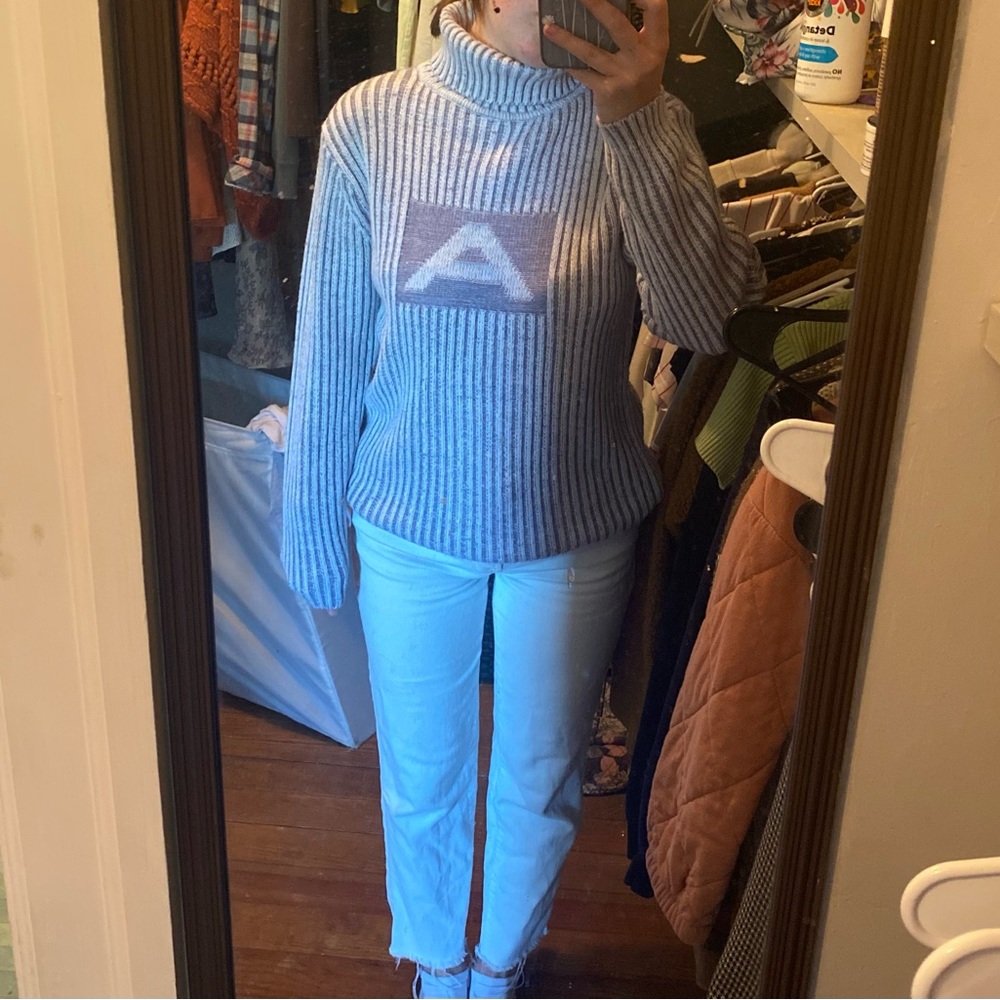 Cozy, corded turtleneck sweater.